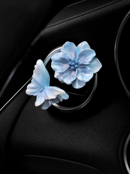 Ocean Blue Butterfly and Bloom pair mounted on a compatible circular car vent