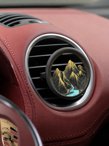 Ink Mountain Stream car vent accent mounted in a premium production-car interior