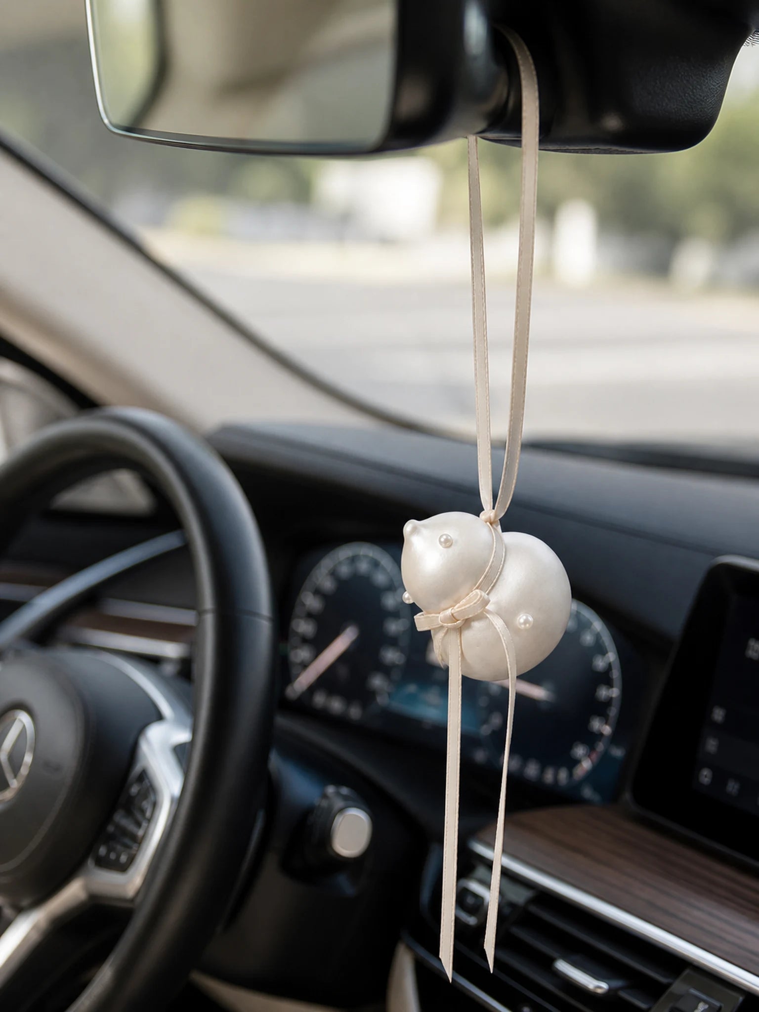Pearl Gourd Hanging Car Charm suspended from a Mercedes-Benz rearview mirror