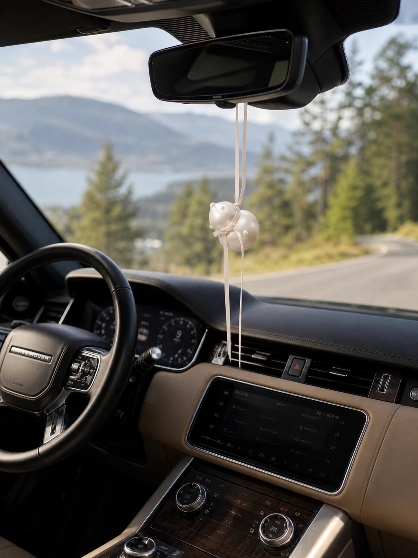 Pearl Gourd Hanging Car Charm suspended in a Range Rover interior