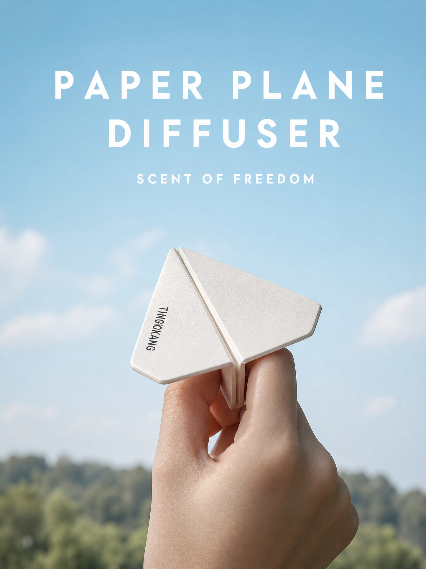 Paper plane air freshener against blue sky background