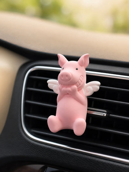 Wish Pig Car Vent Diffuser secured to a car vent