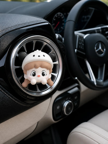Cream Cap Girl car vent charm installed in a Mercedes-Benz interior