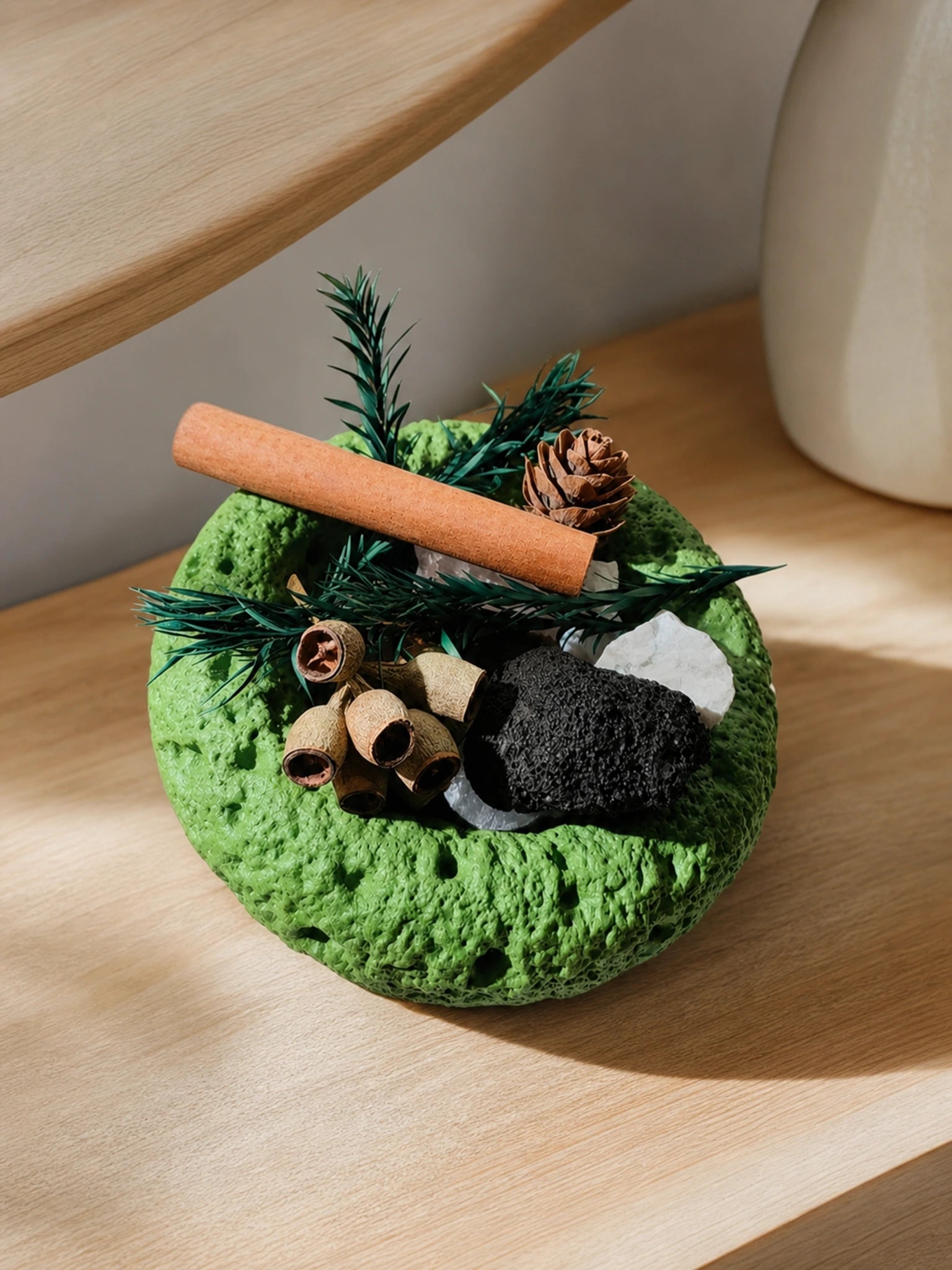 Emerald Forest Stone Decor on a light wood surface