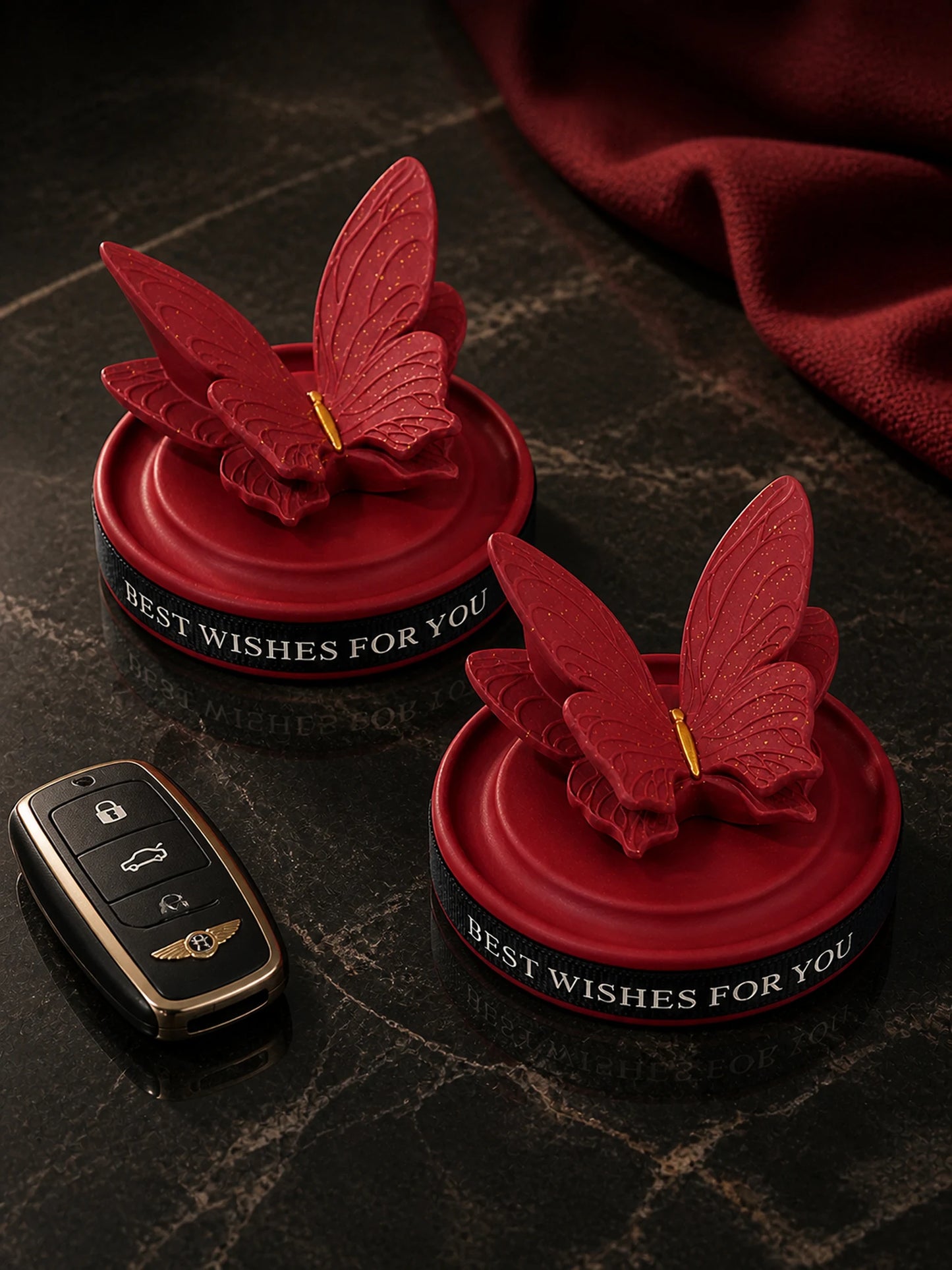 Two Burgundy Butterfly Dashboard Ornaments styled as an optional pair
