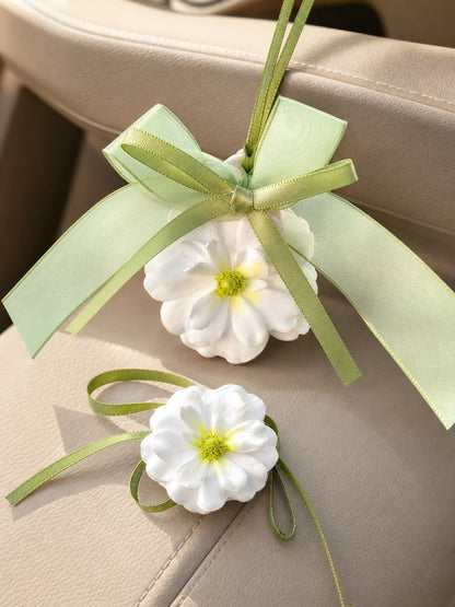 Green ribbon and sculpted flower detail