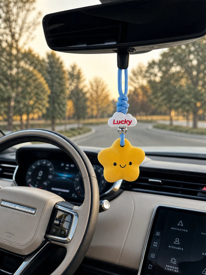 Lucky Star charm hanging in a Range Rover interior