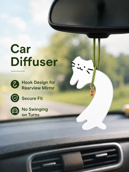 Cat air freshener hanging on car rearview mirror