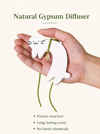Cat shaped hanging diffuser with green string