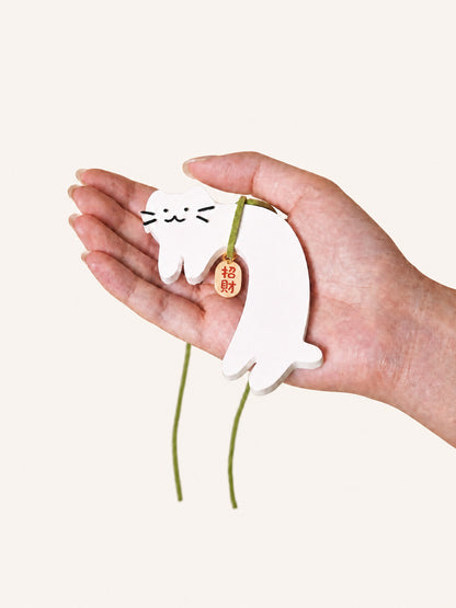 Cute white cat gypsum air freshener held in hand