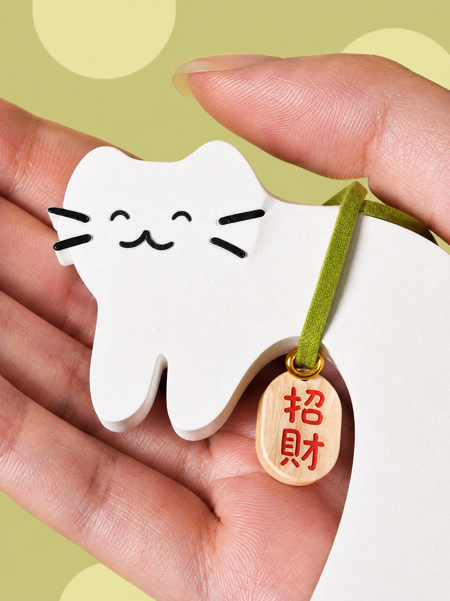 Cute white cat gypsum air freshener held in hand