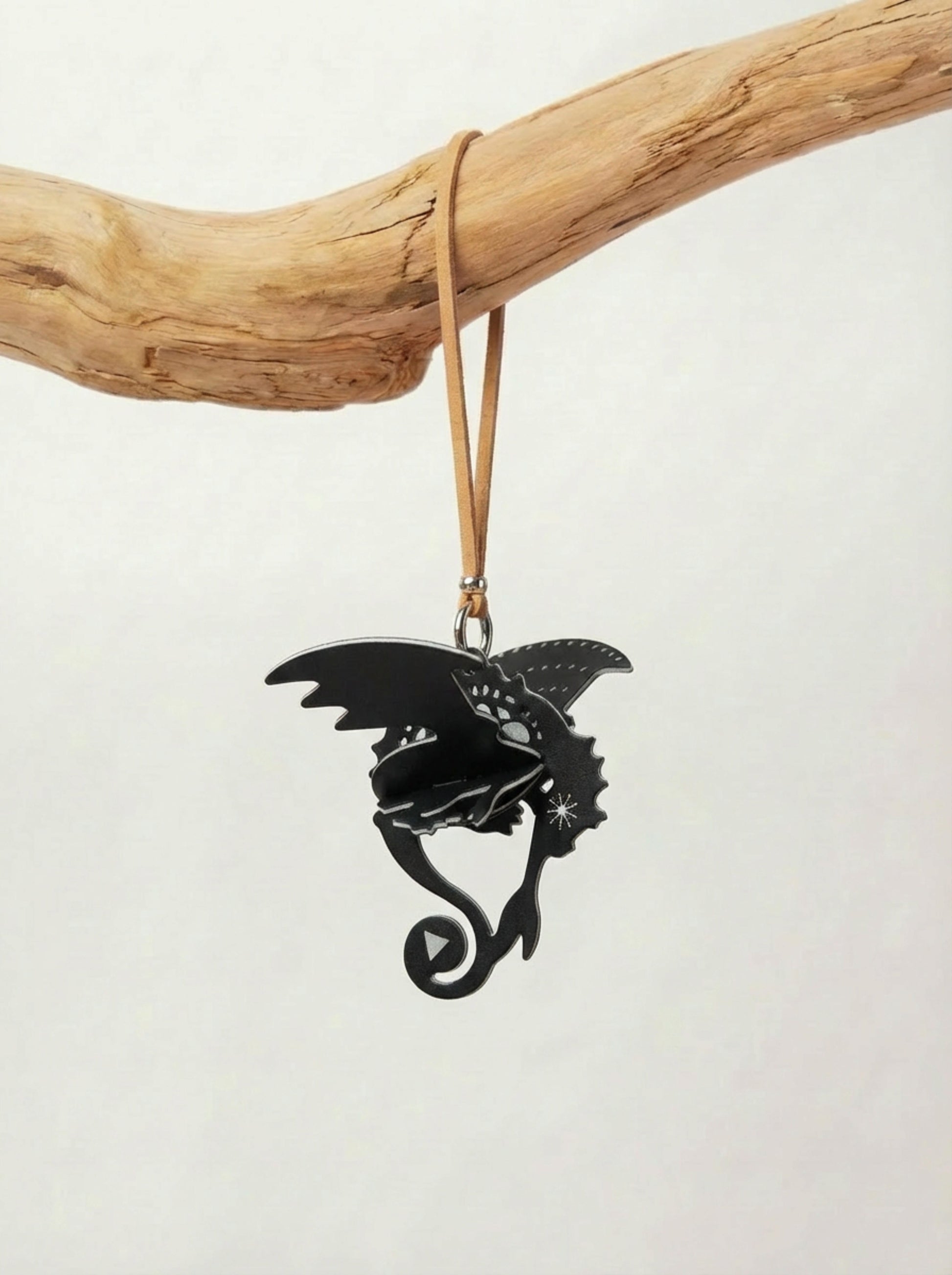 Dragon fragrance charm hanging as decorative car scent