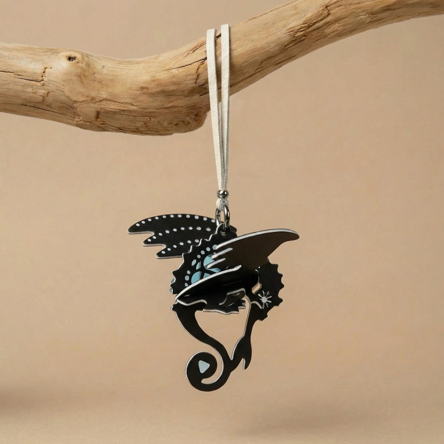 Hand-assembled dragon paper fragrance charm in black and warm tones