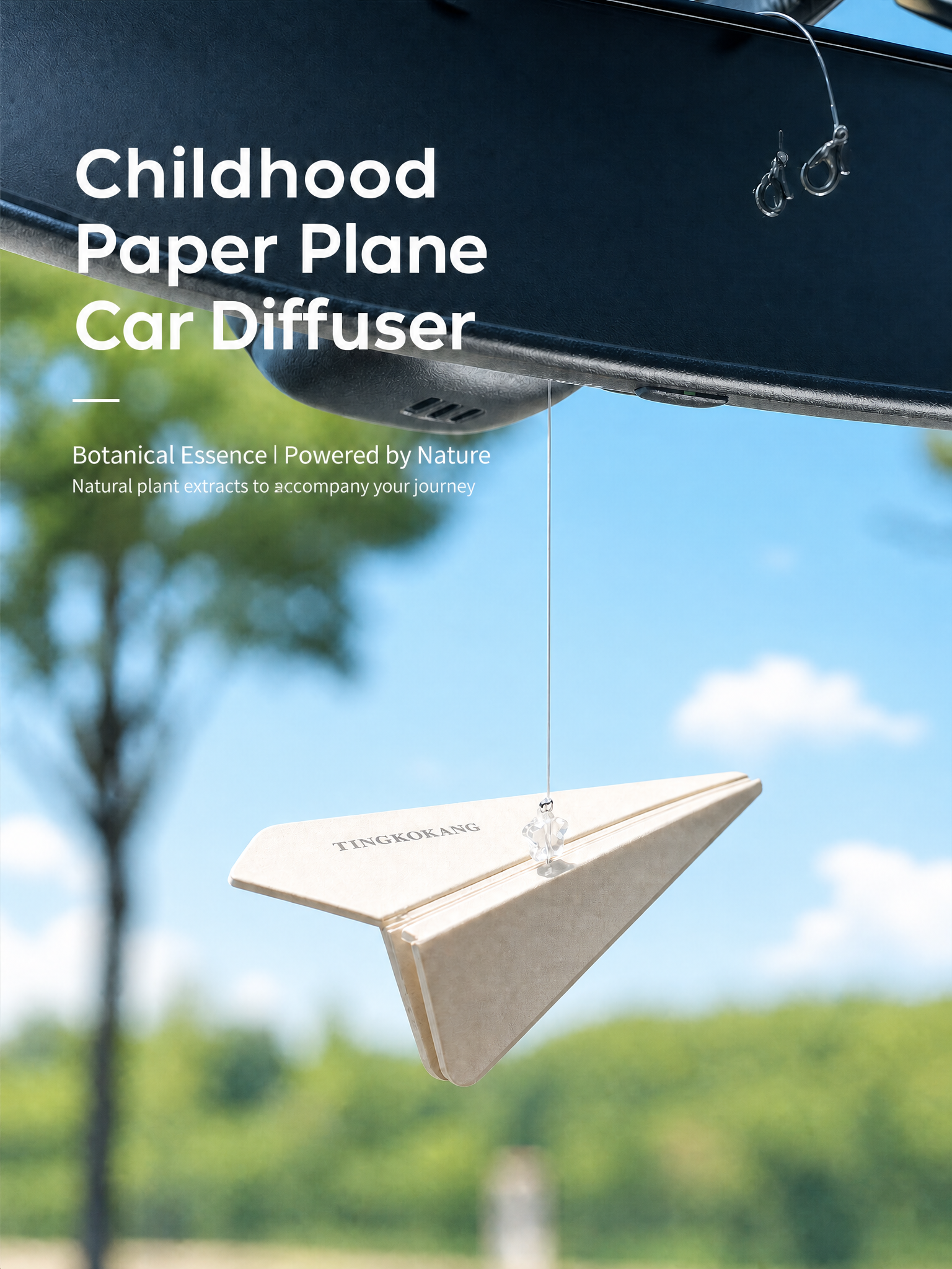Paper plane air freshener against blue sky background