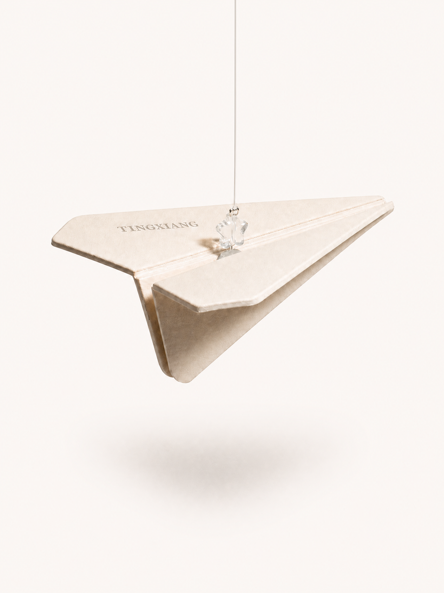 Minimalist_white_paper_plane_air_freshener_on_beige_background