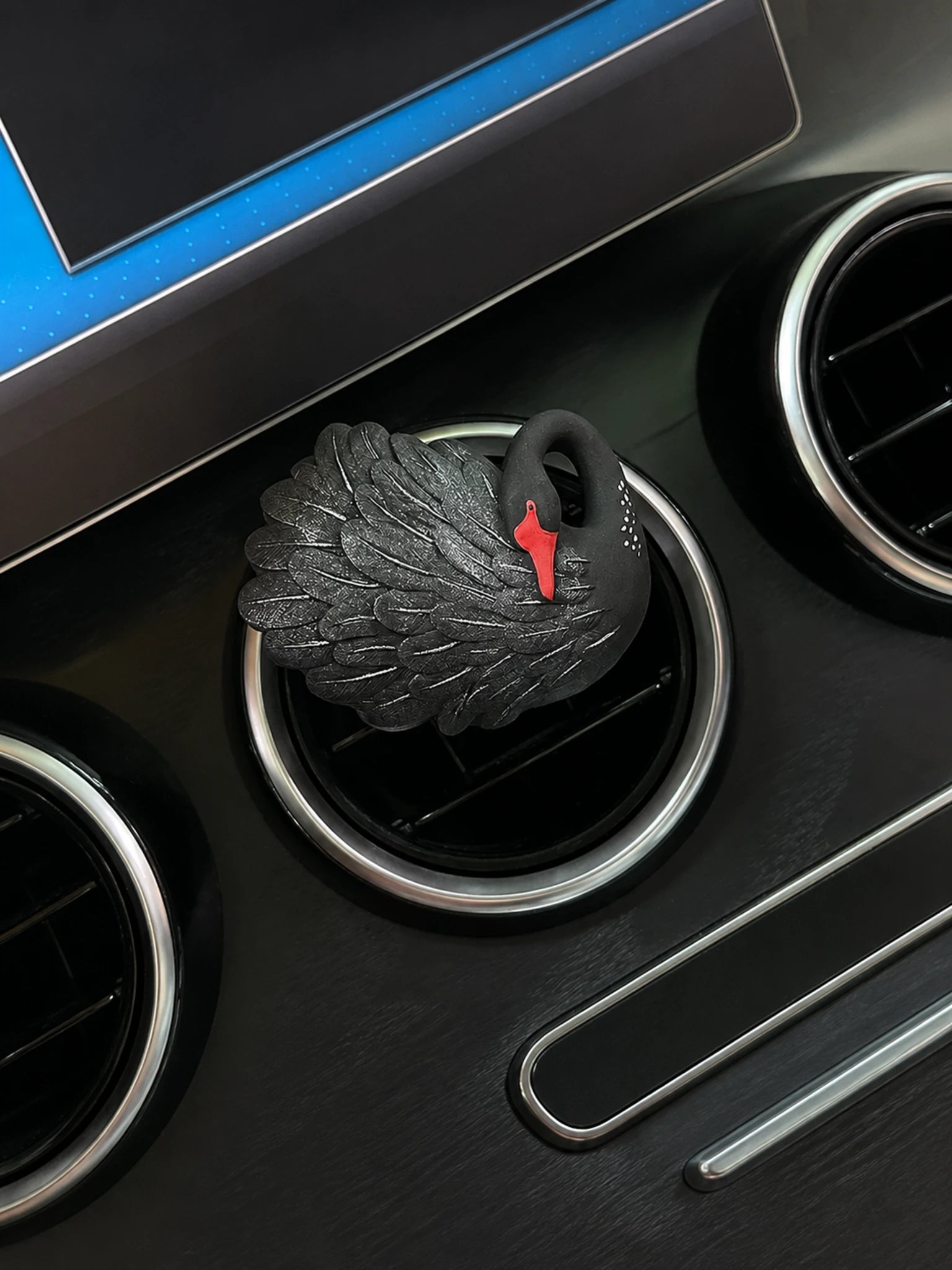 Black Swan car vent accent installed on a compatible circular vent