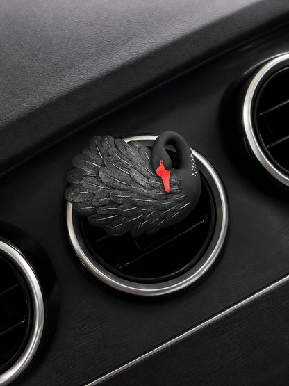 Black Swan sitting squarely on a compatible circular car vent