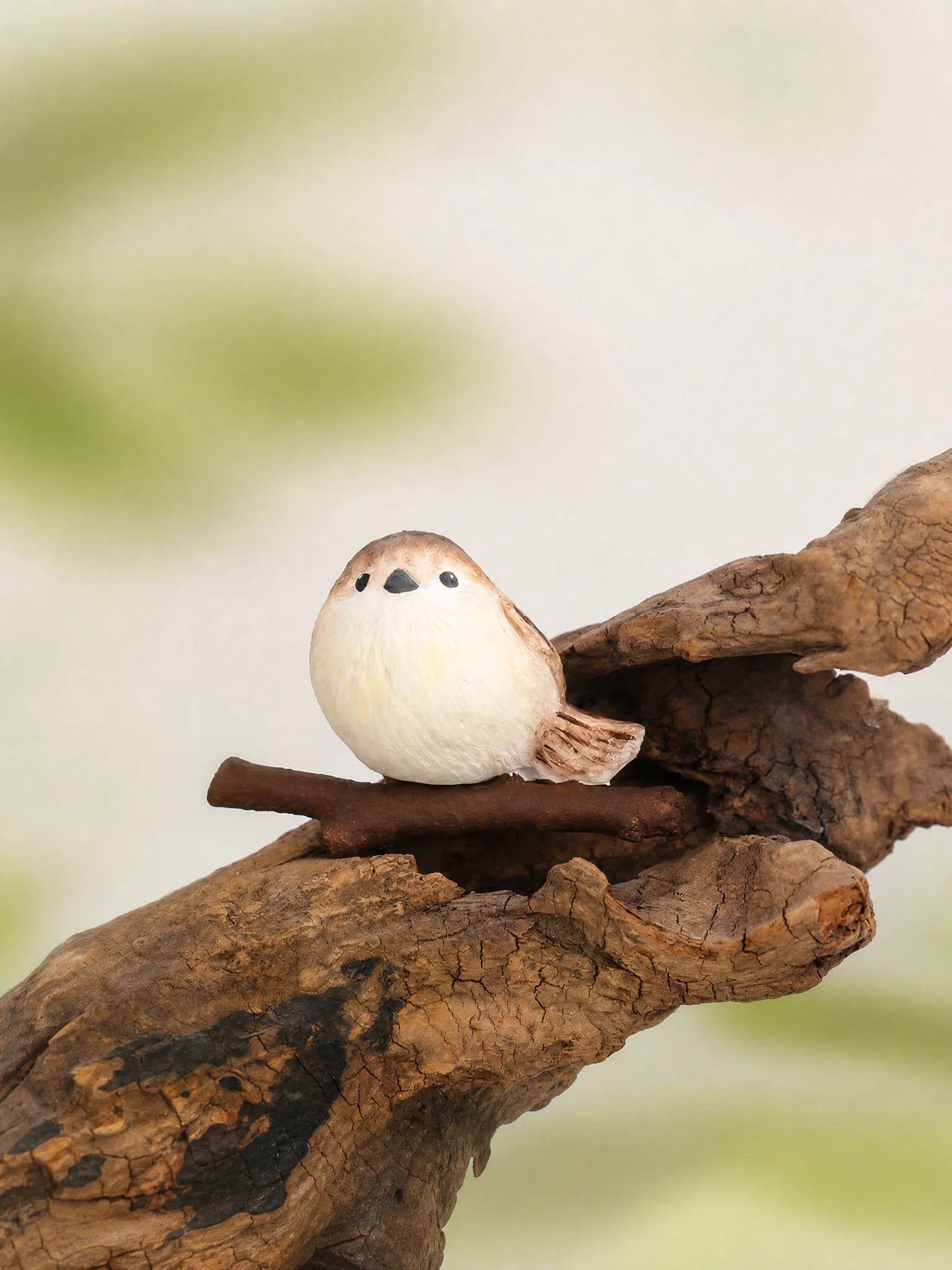 Chubby bird diffuser sitting on tree branch natural scene