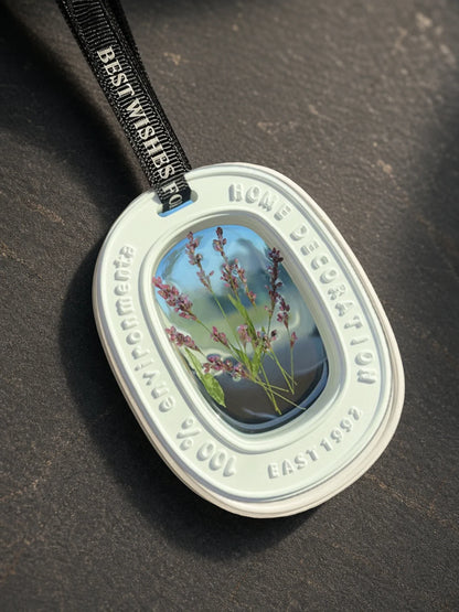 Close detail of real dried purple stems inside the transparent oval window