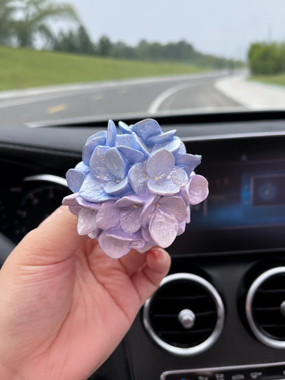 Blue Lilac Hydrangea Bloom shown in hand for scale