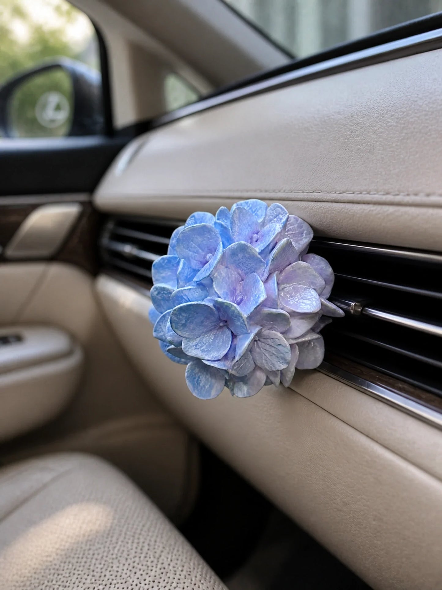 Blue Lilac Hydrangea Bloom installed squarely on a compatible horizontal car vent