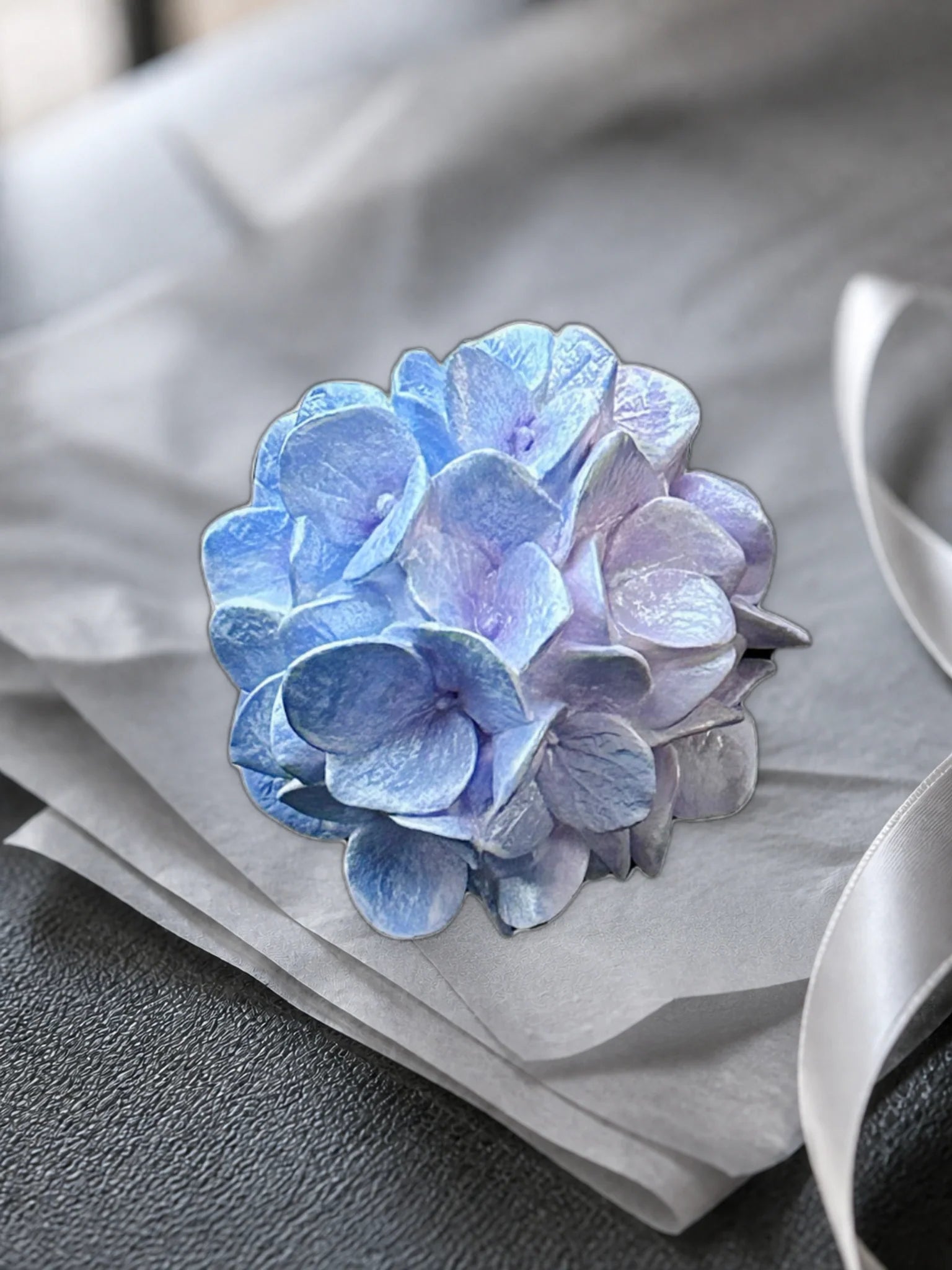 Blue Lilac Hydrangea Bloom presented with neutral tissue for gifting inspiration