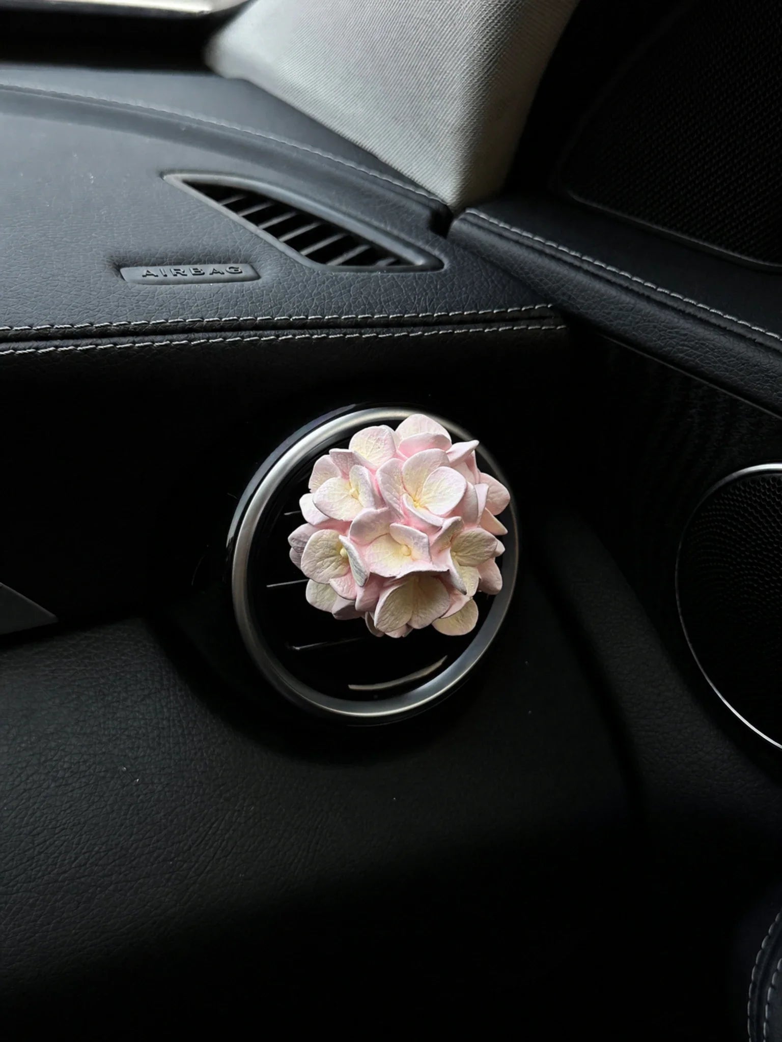 Pastel Blush Hydrangea Bloom installed on a compatible round car vent