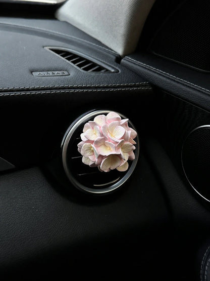 Pastel Blush Hydrangea Bloom installed on a compatible round car vent