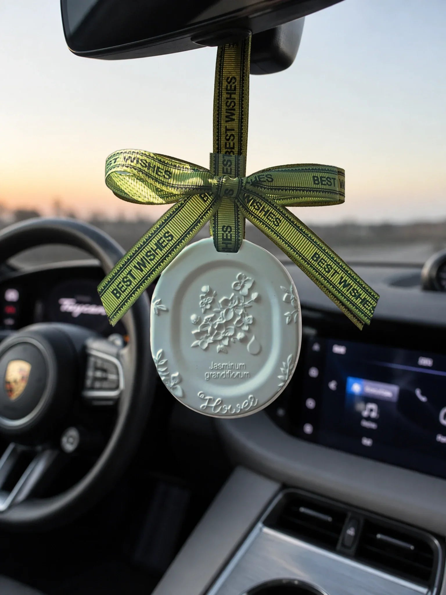 White Jasmine medallion hanging naturally in a second premium car interior