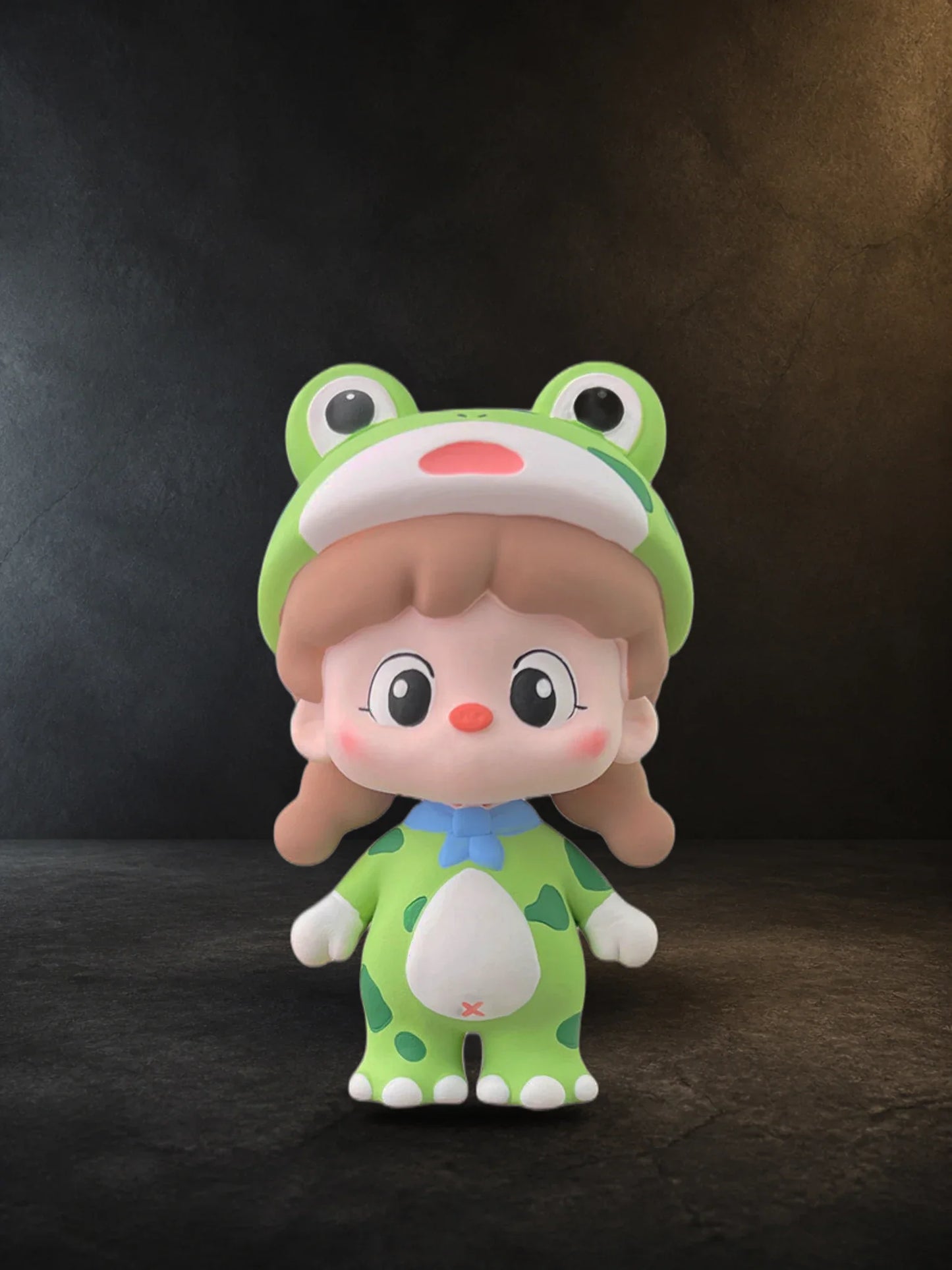 Close editorial view of the Green Frog Girl face, frog hood, blue bow and spotted suit
