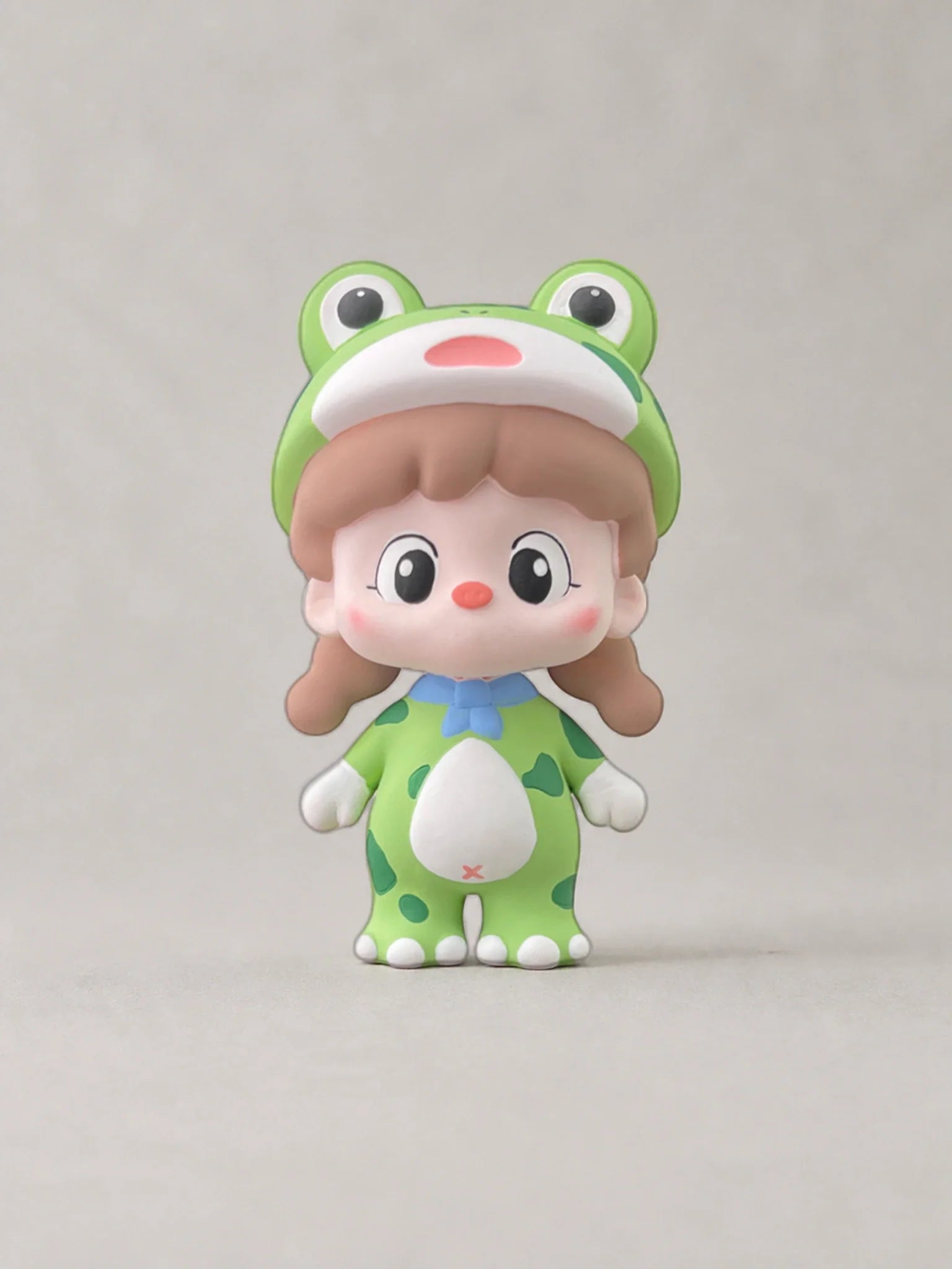 Green Frog Girl car vent ornament with original frog hood, blue bow and spotted suit