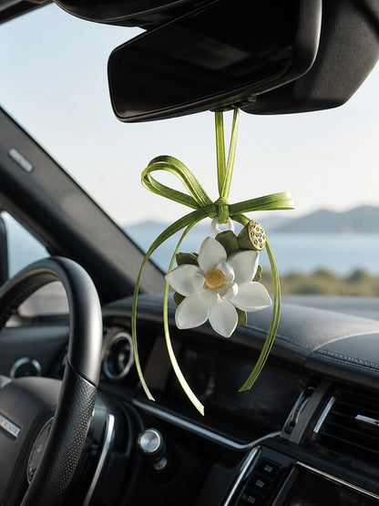 Lotus Serenity hanging car charm suspended beneath a Range Rover rearview mirror