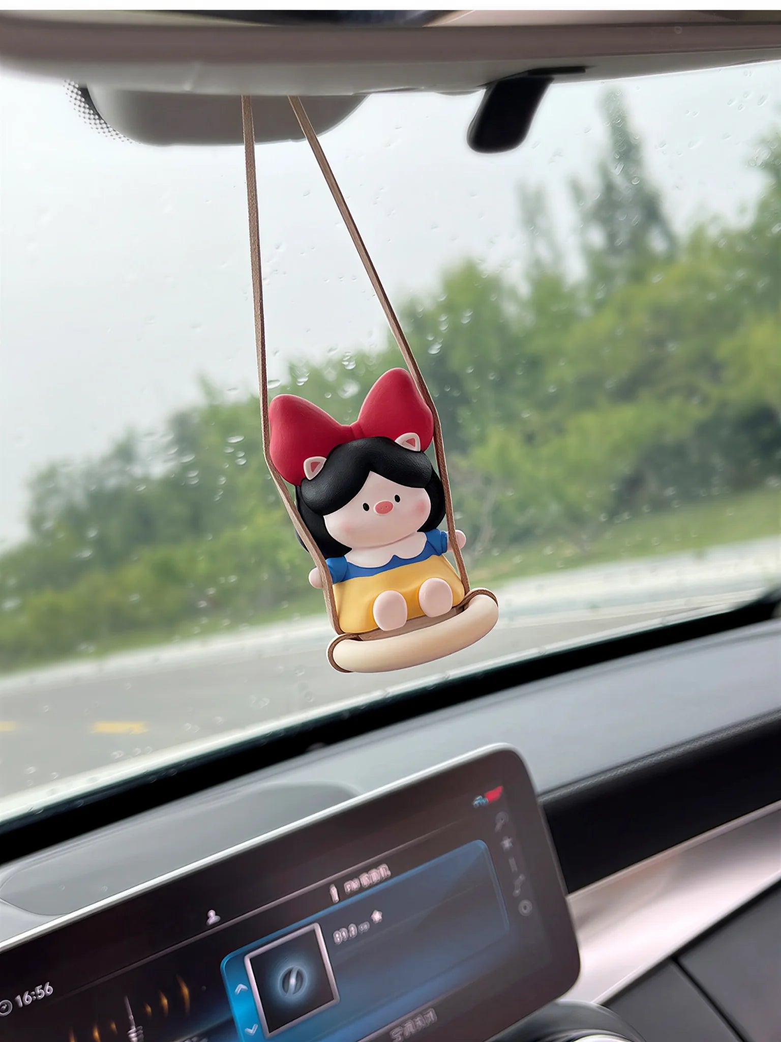 Side view of Pig Princess diffuser on car rearview mirror