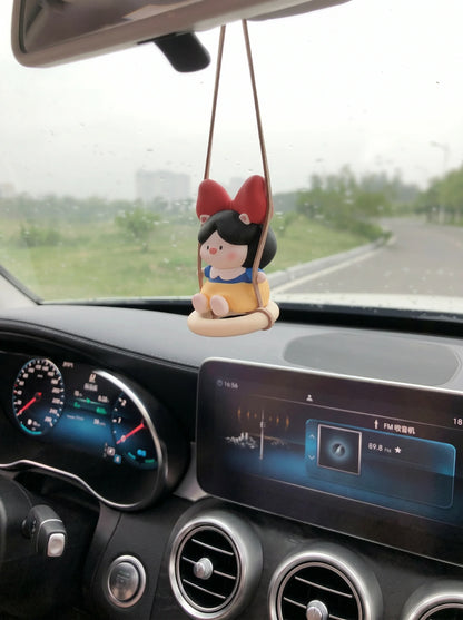 Pig Princess diffuser swinging on car rearview mirror
