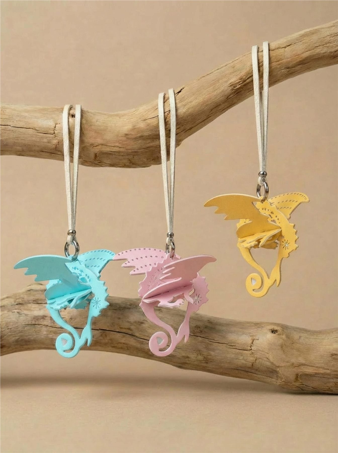 Hand-assembled dragon paper fragrance charm in black and warm tones