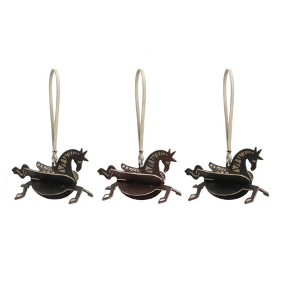 Horse decorative fragrance charm hanging in a car or small space