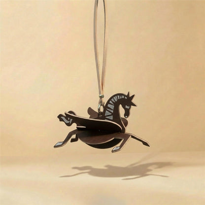 Horse decorative fragrance charm hanging in a car or small space