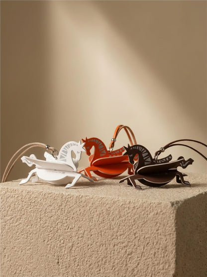 Horse fragrance charm detail with sculptural paper design