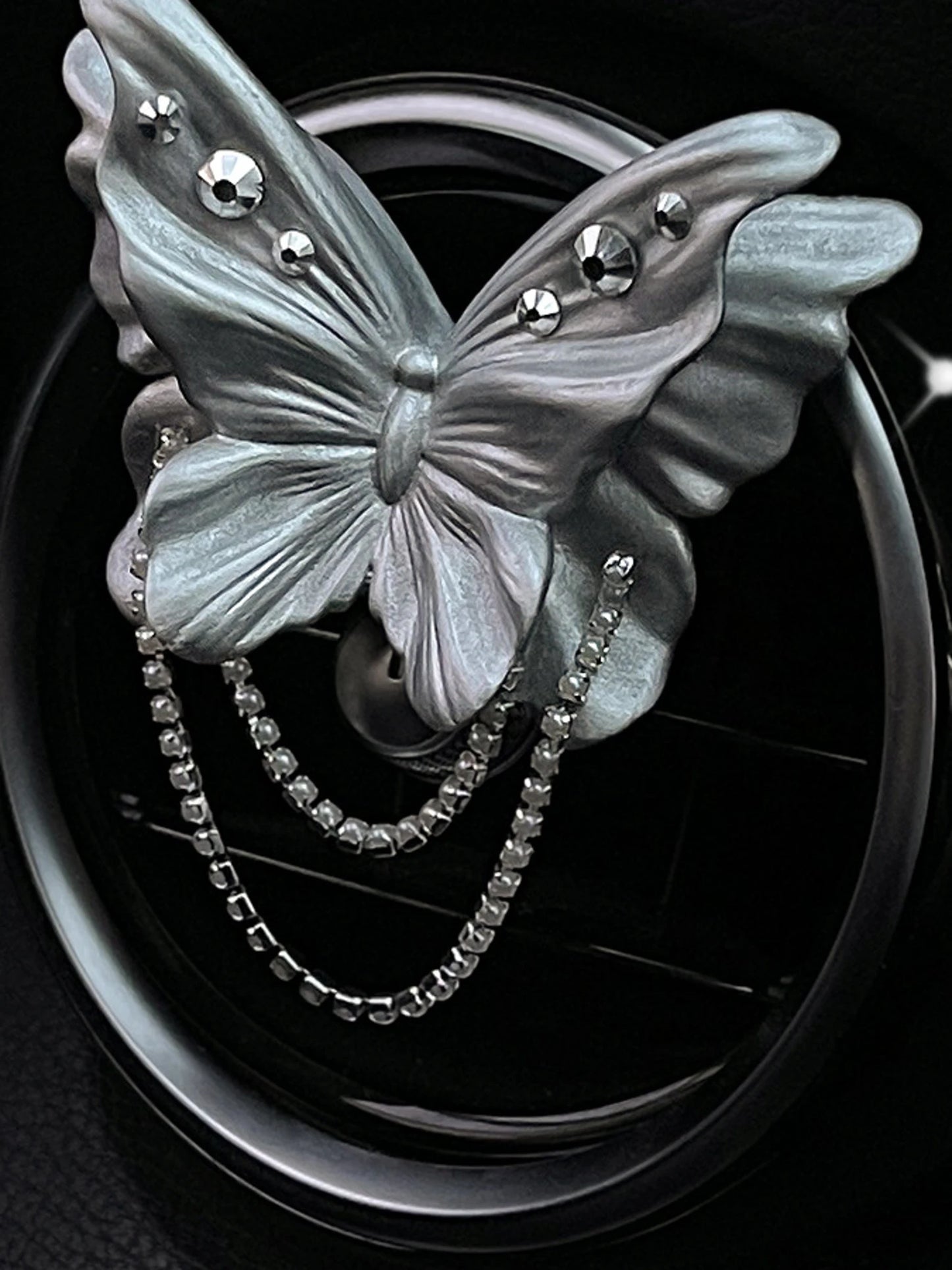 Close detail of the jeweled pearl silver butterfly ornament