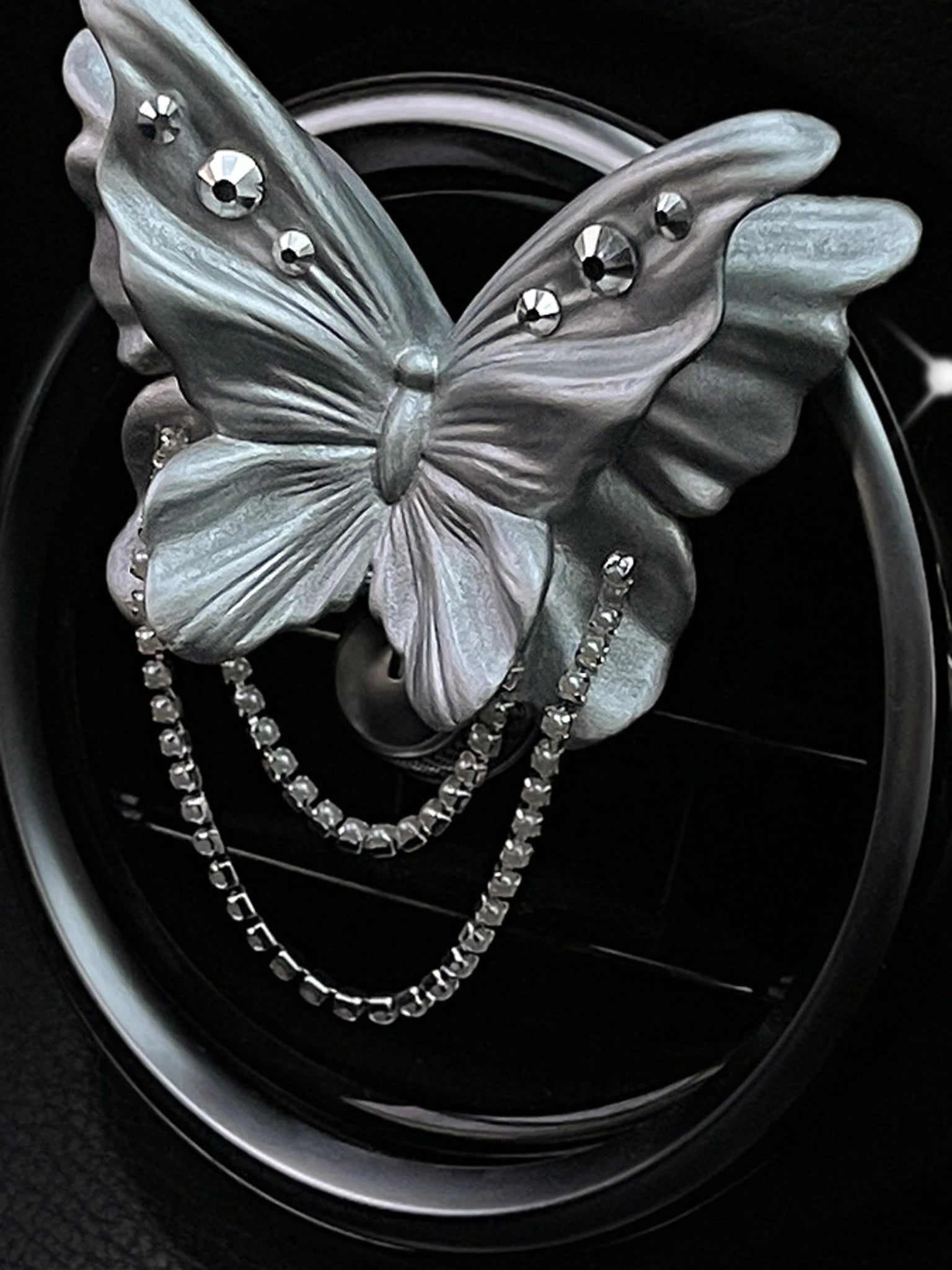 Close detail of the jeweled pearl silver butterfly ornament
