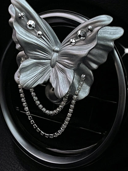 Close detail of the jeweled pearl silver butterfly ornament