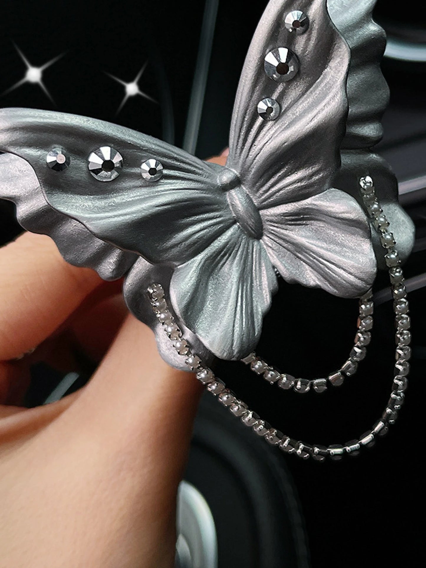 Close detail of the butterfly chains and crystal accents