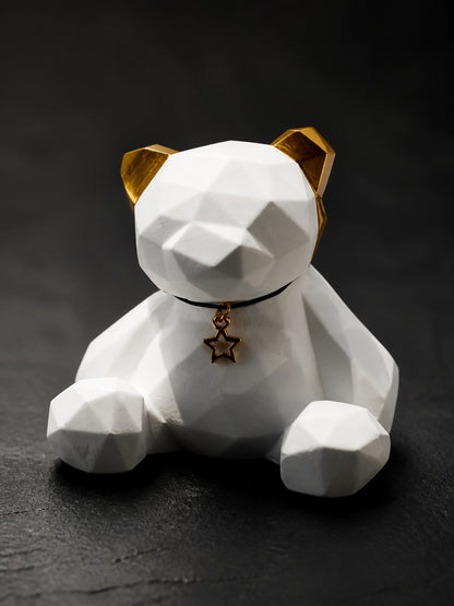 Close detail of the Golden Ear bear faceted white surface and seated form