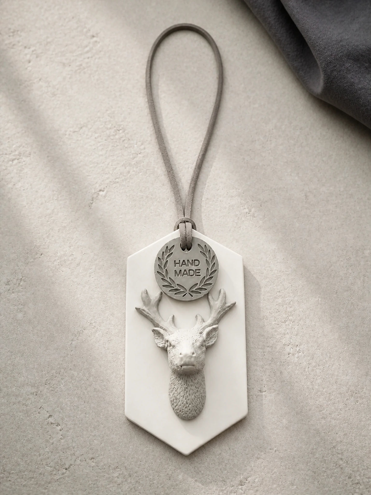 White plaque, gray stag relief, dark cord and separate HAND MADE round medallion