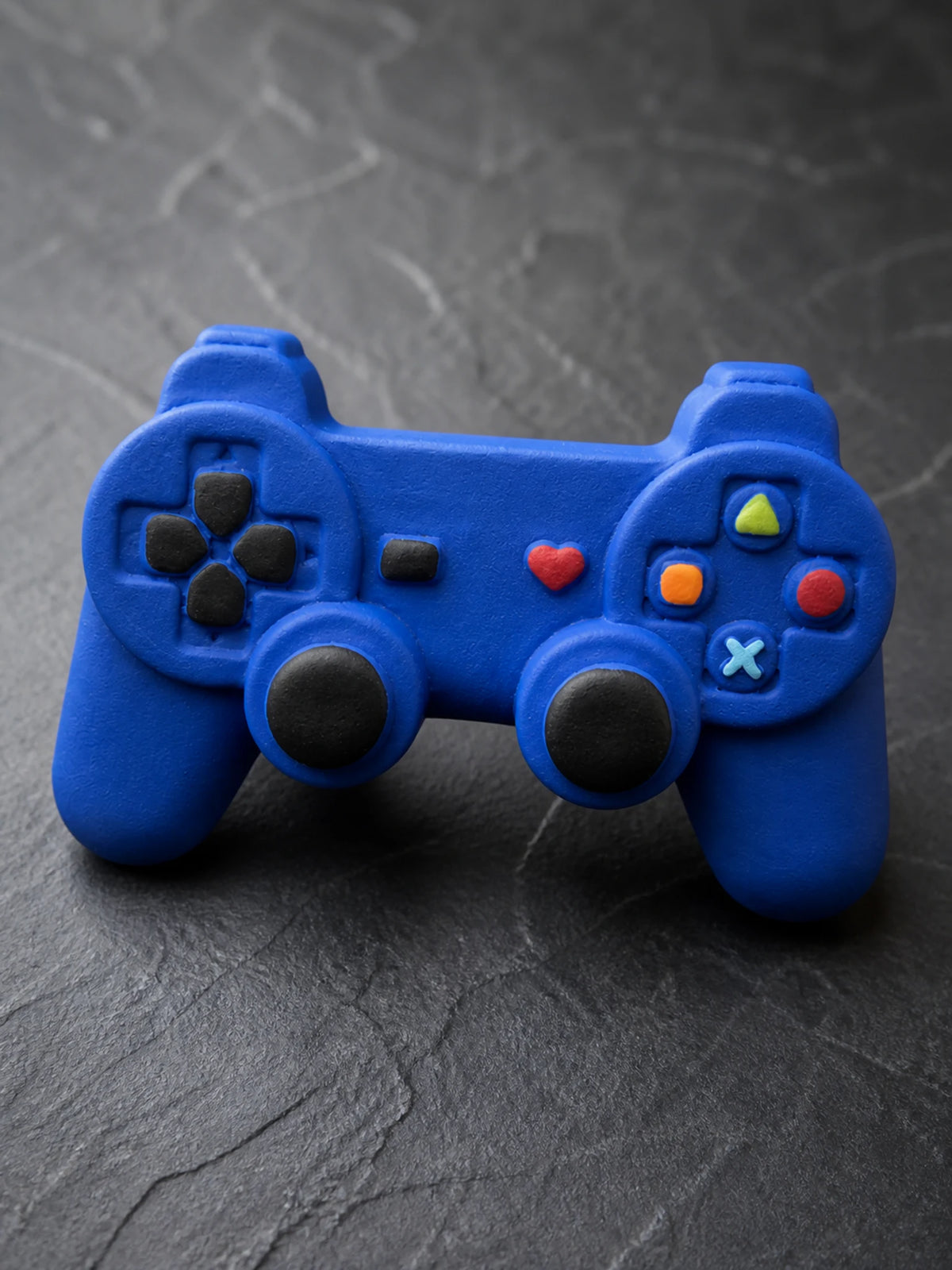 Close view of the controller button layout and cobalt-blue surface