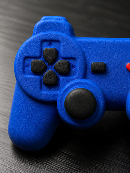 Macro detail of the black directional pad, analog controls and center button