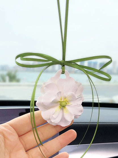 Ivory peony charm with a green center and olive ribbon