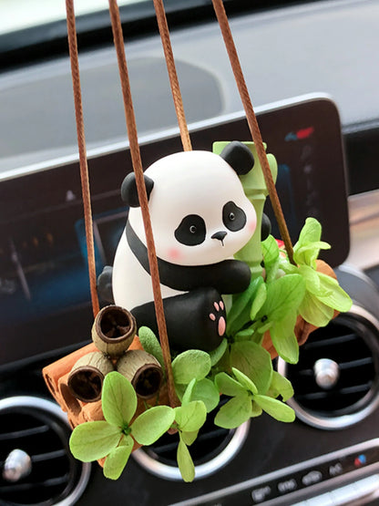 Bamboo Panda car charm hanging naturally below a rearview mirror