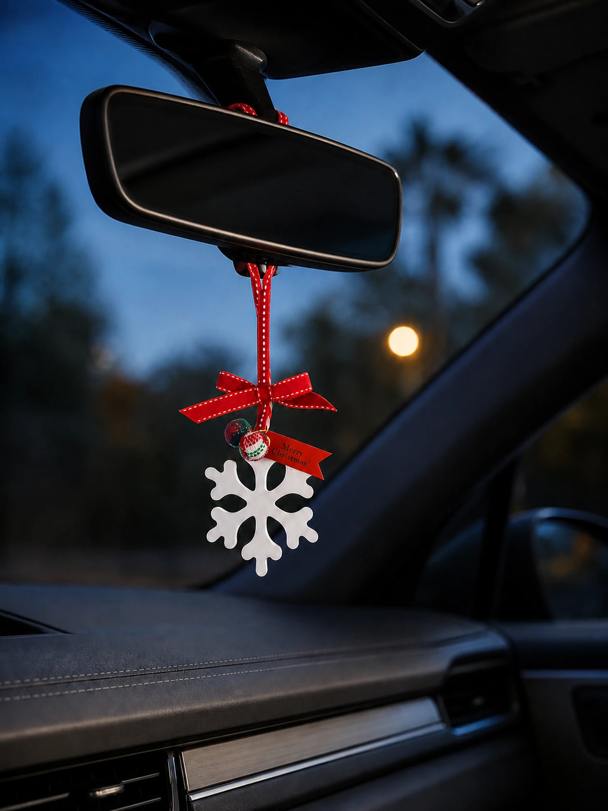 White snowflake hanging ornament in a premium blue-hour cabin
