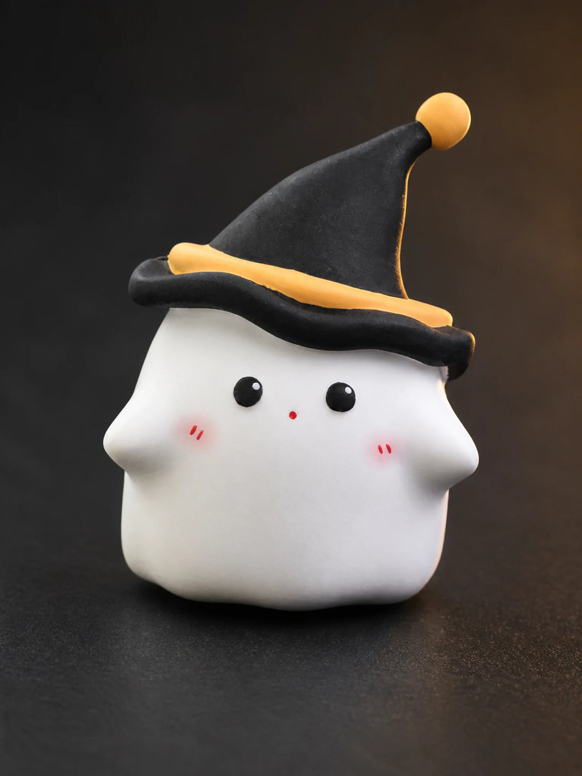 Close detail of the Midnight Ghost face and black hat with orange trim